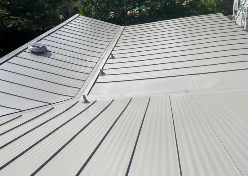 Solar attic fan installed on a metal roof for Roof Ventilation in Malvern